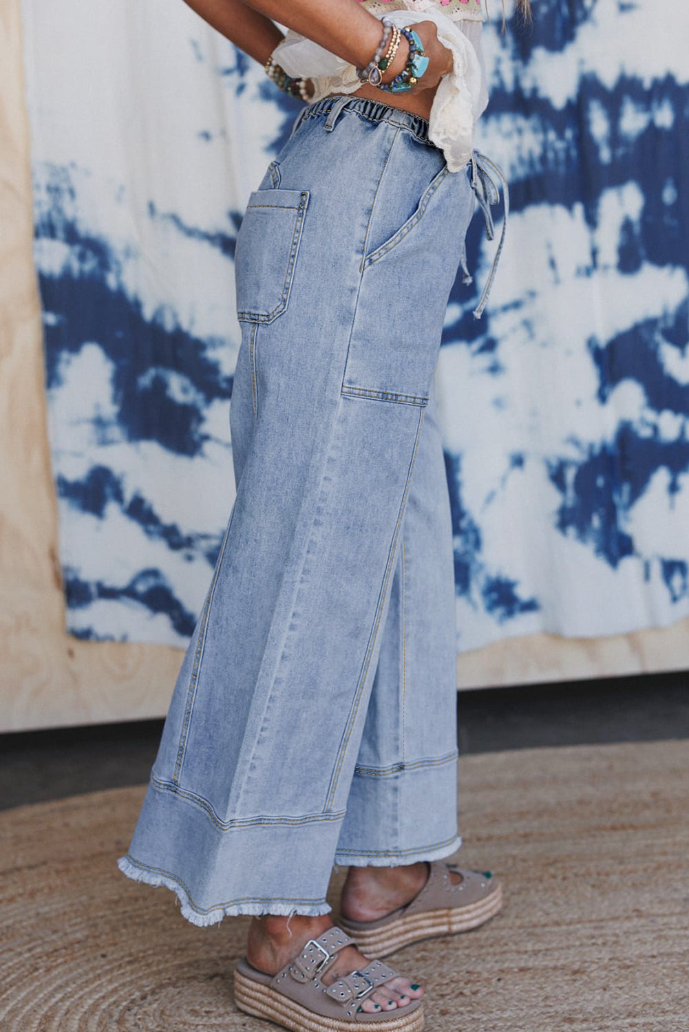Wide leg drawstring jeans three quarter view