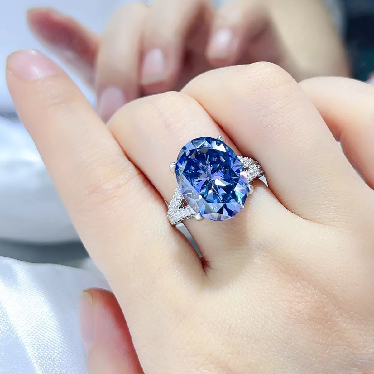 10 carat blue moissanite sterling silver ring, front view
