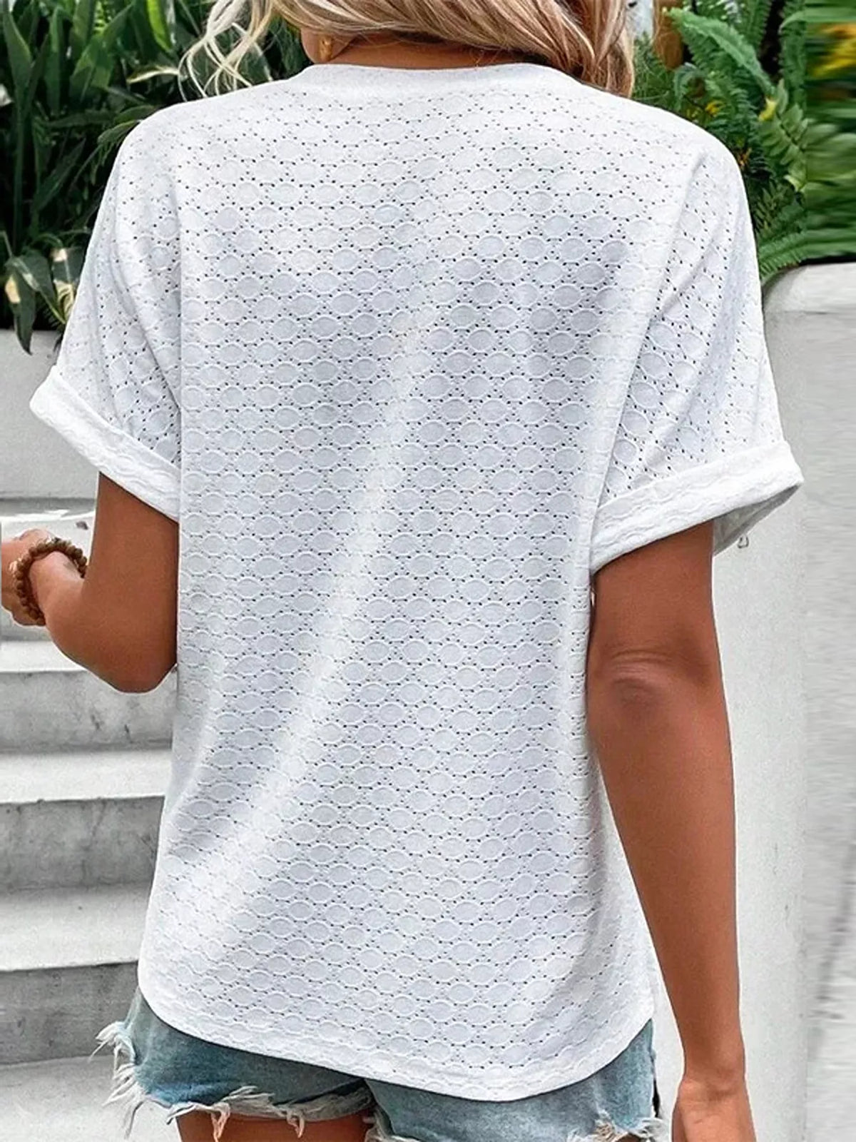 Short sleeve textured top shown from the back