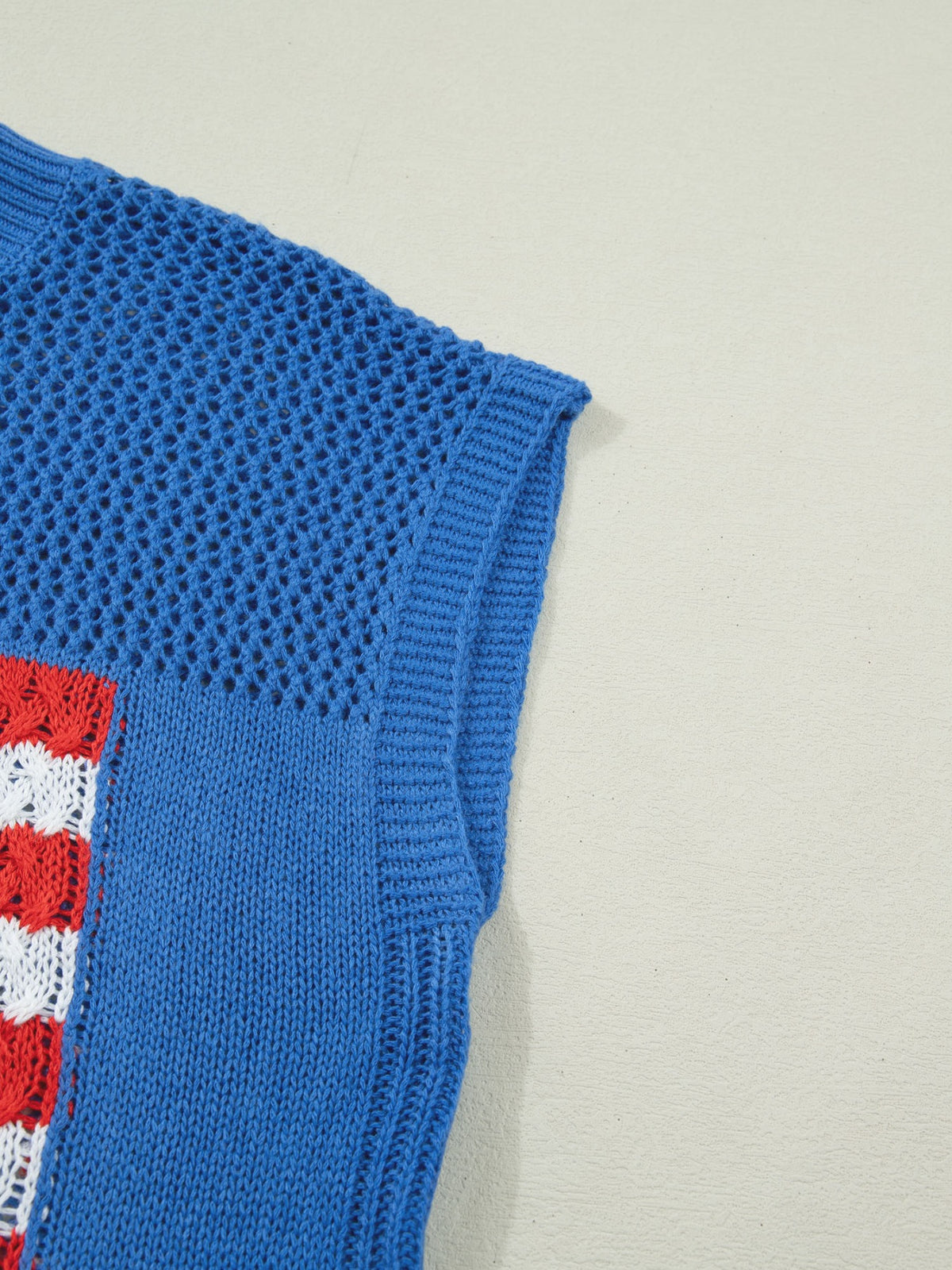 Flag graphic sweater top layered over shirt