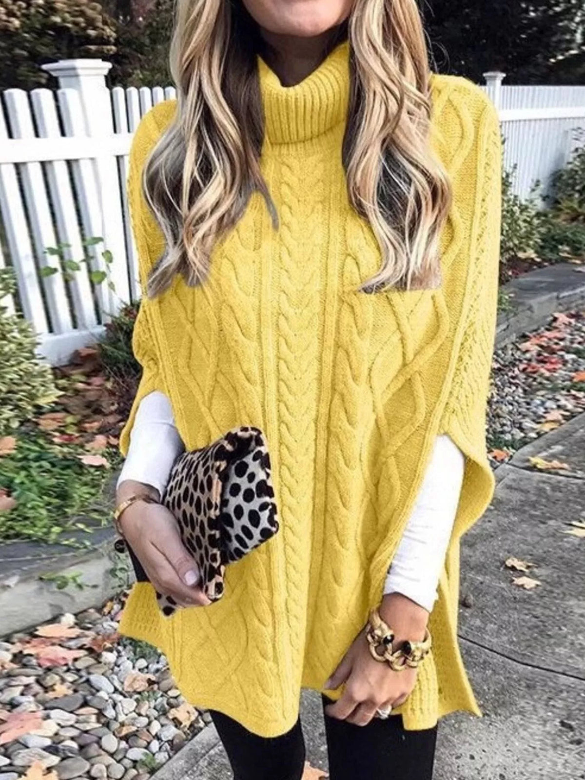 Chunky cable knit turtleneck poncho full length view
