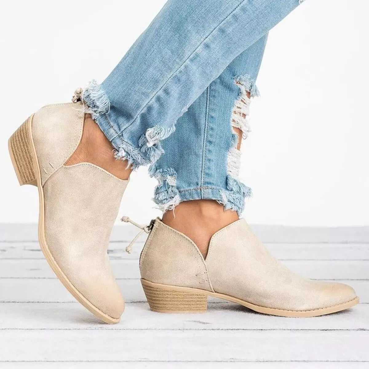 Point toe low heel boots pair styled together