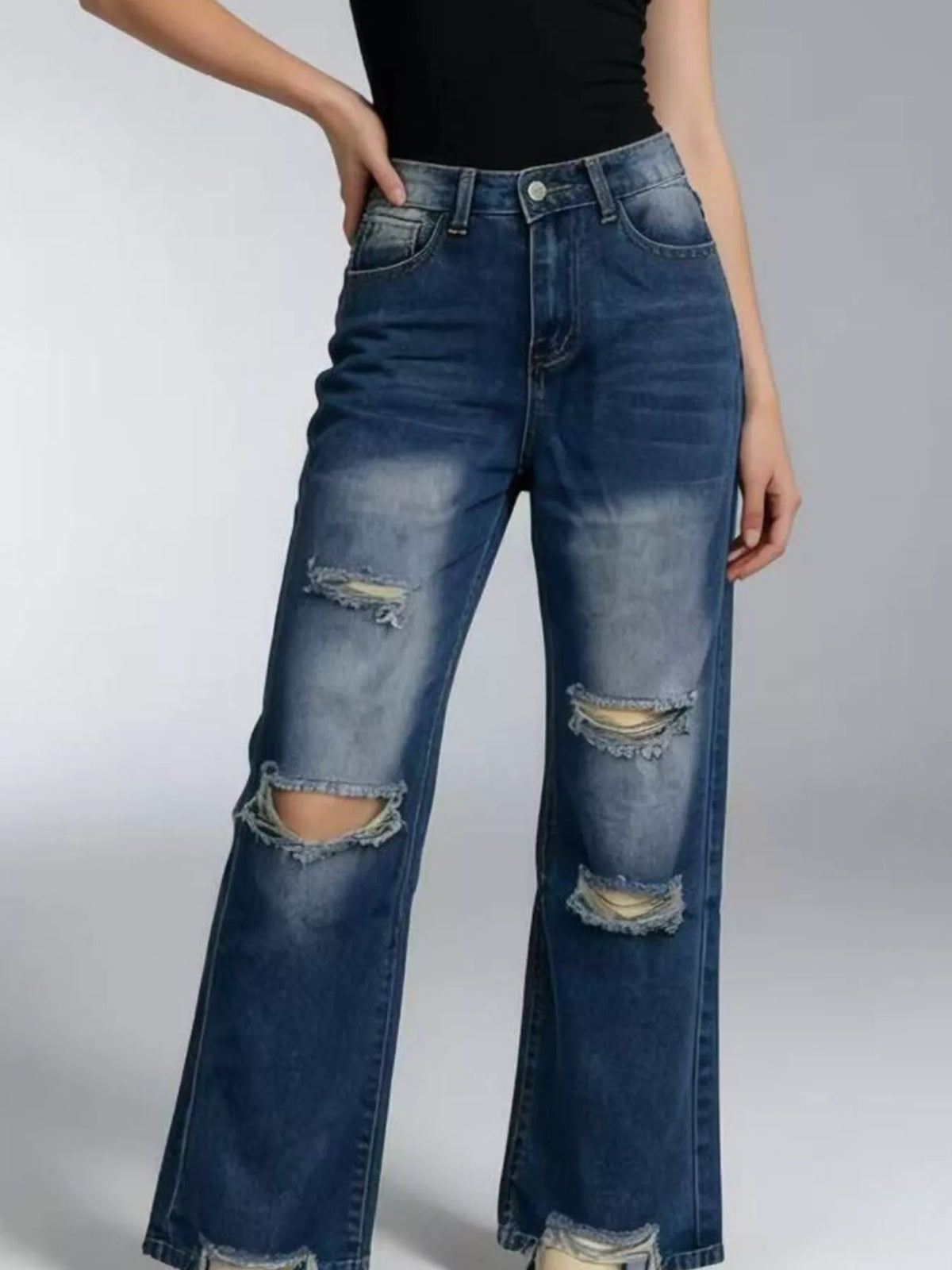 Back view of distressed wide leg jeans