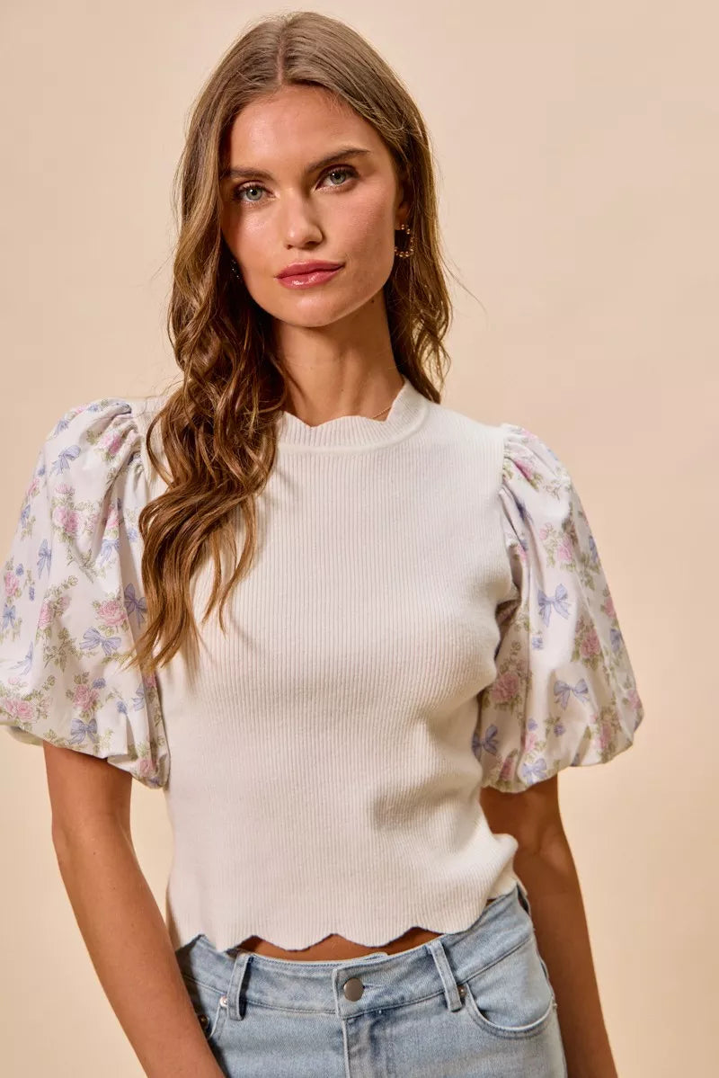 Floral print scallop sweater top styled with jeans