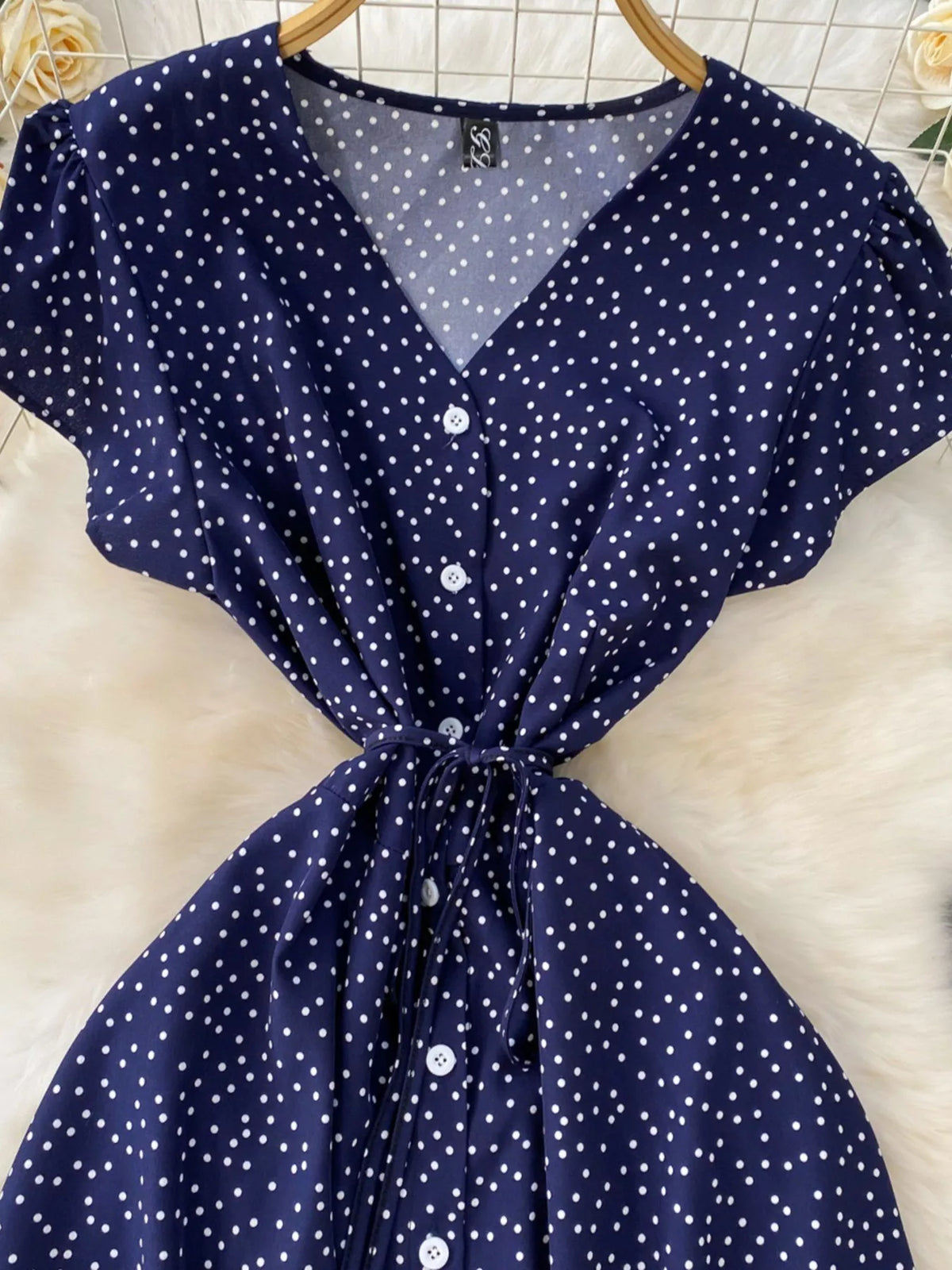 Dark blue polka dot belted maxi dress back view