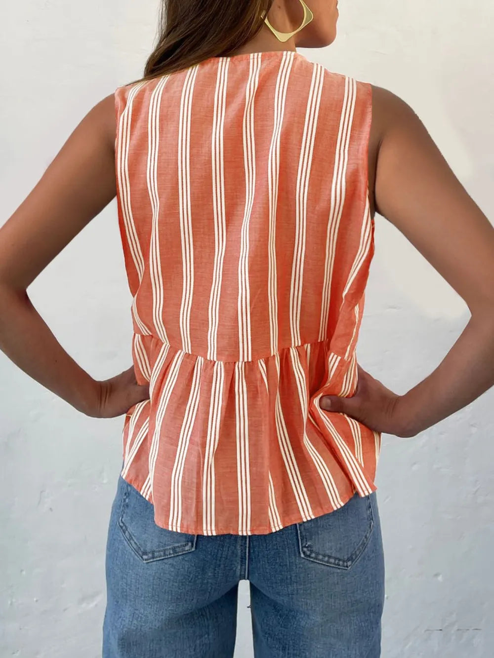 Striped tank top styled with denim shorts