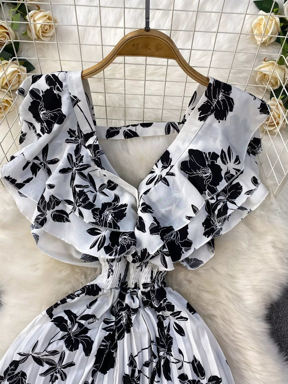 Floral print wide leg pleated jumpsuit detail view