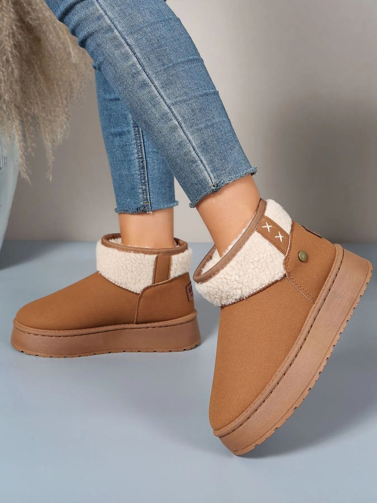 Sherpa lined platform winter boots pair styled together