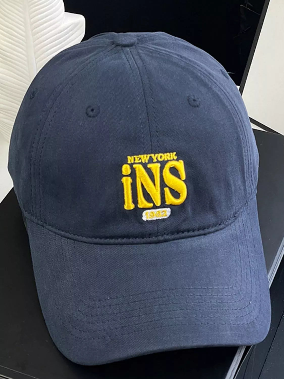 Embroidered baseball cap shown in brown
