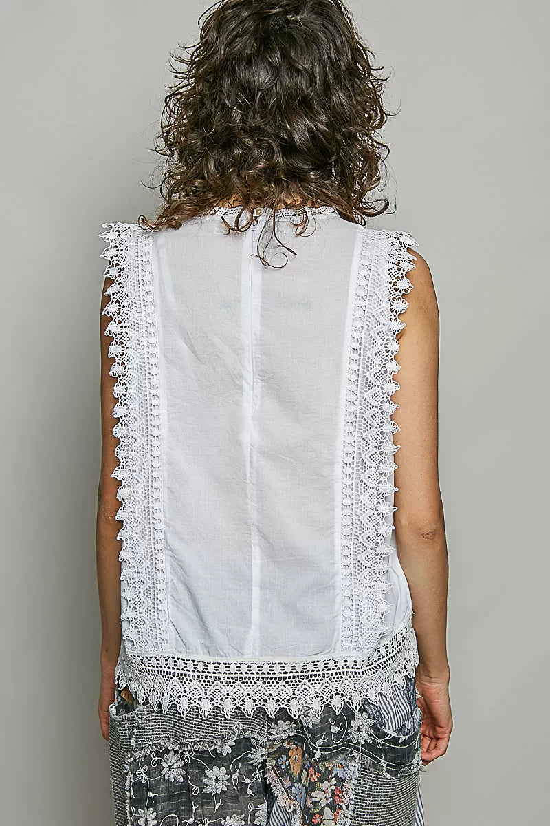 Sleeveless lace top botanical embroidery close up