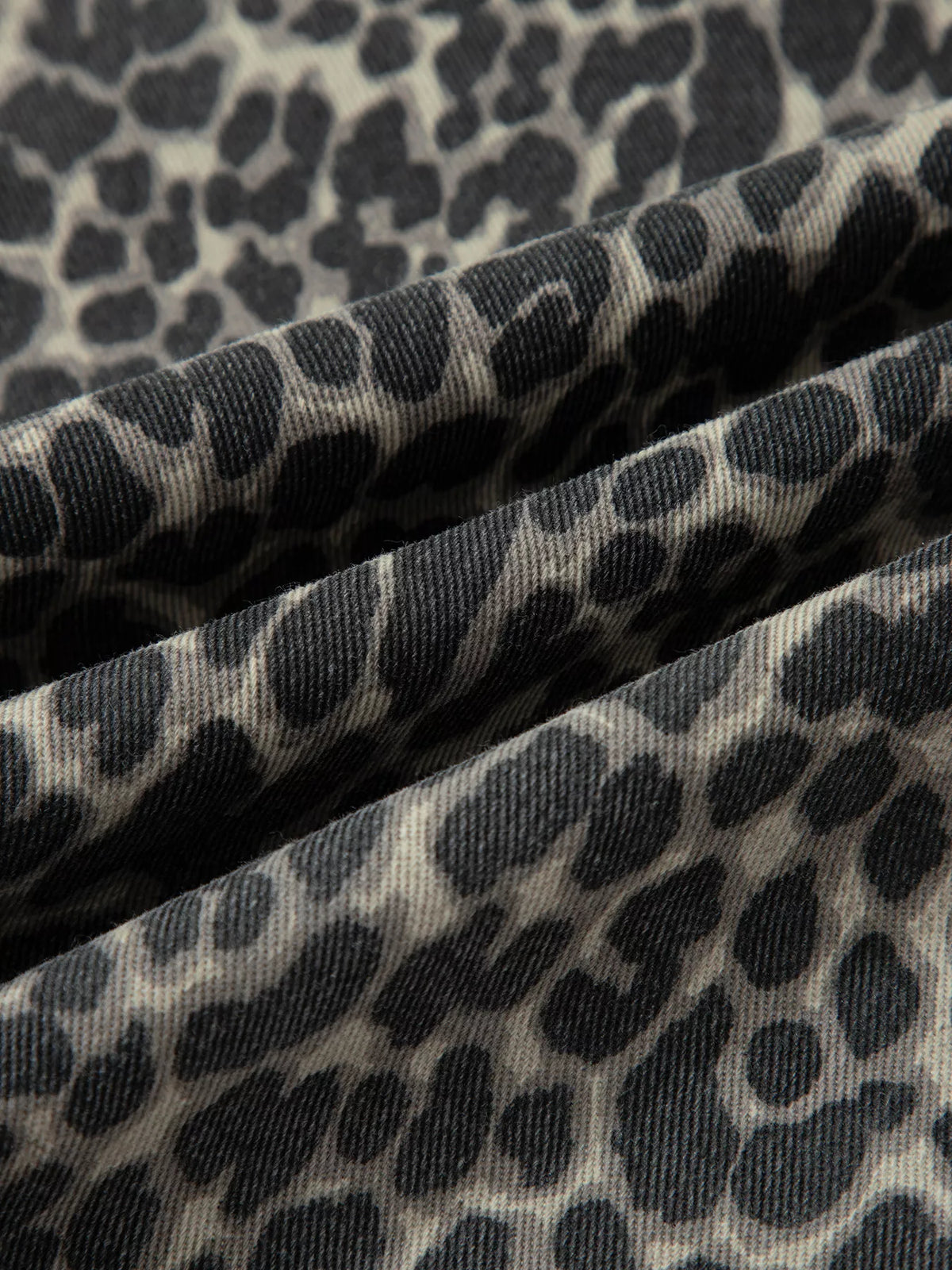 Model wearing leopard print high waist barrel jeans