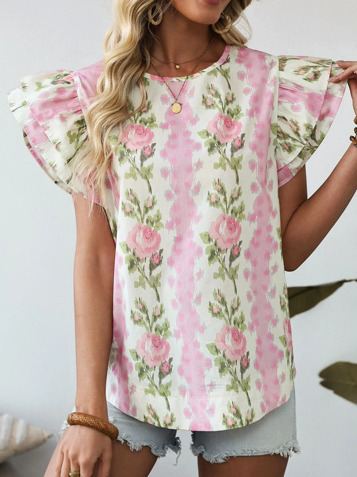 Ruffled sleeve detail on floral blouse