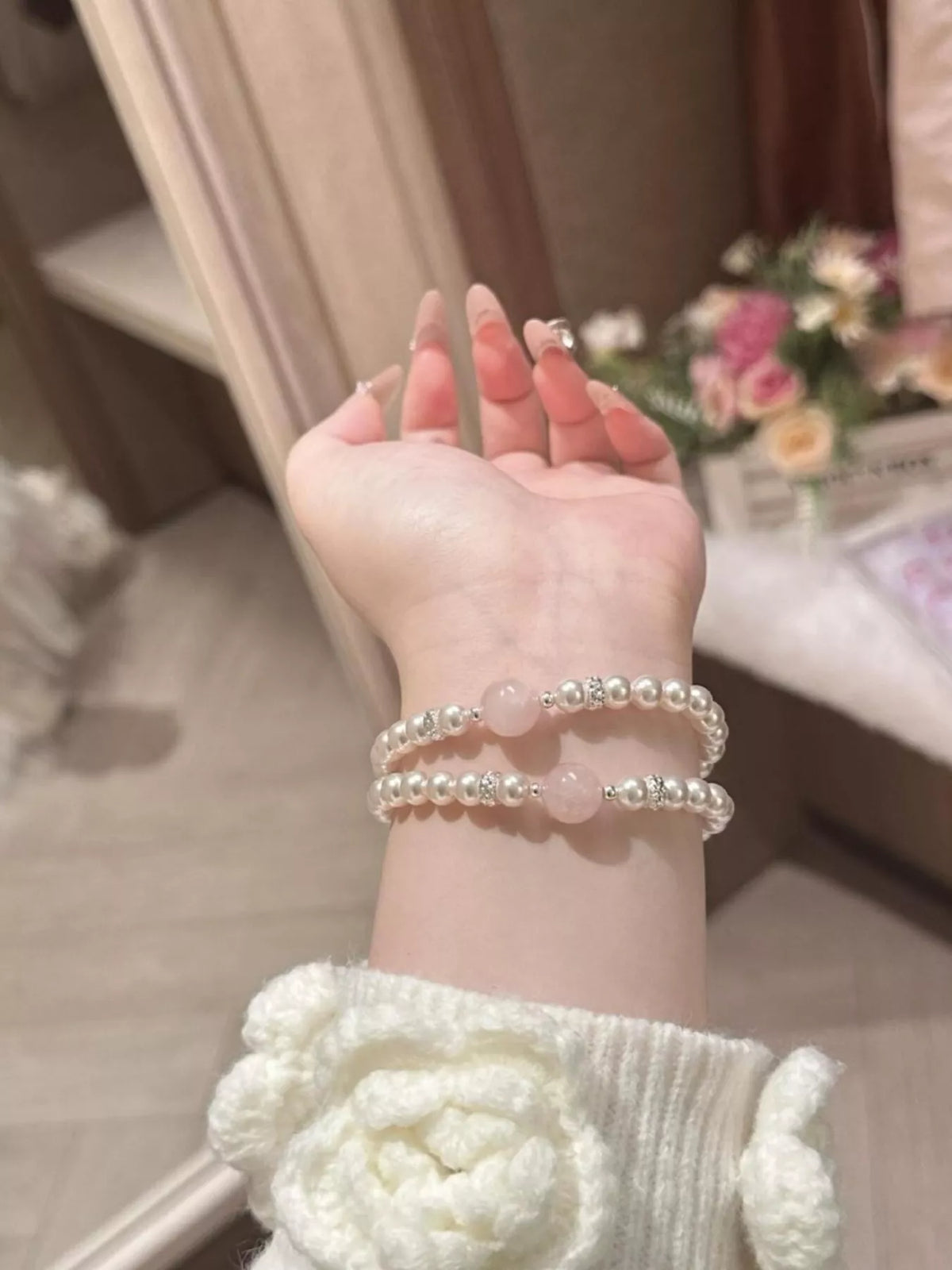 Blush pink pearl and crystal bracelet styling detail