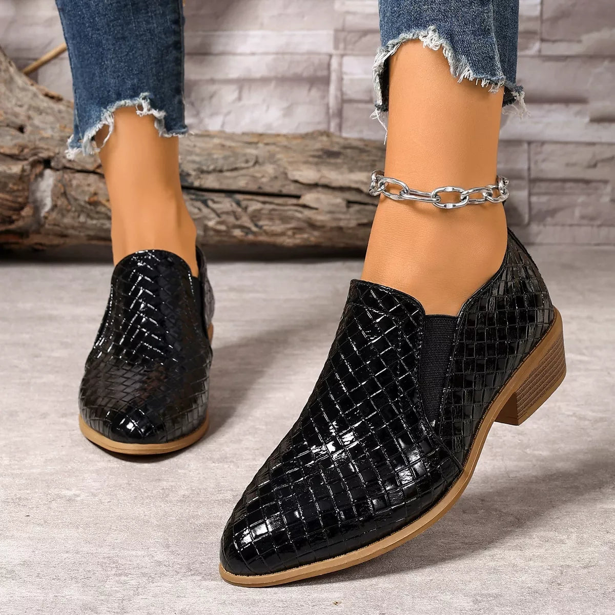 Brown point toe block heels ankle boots angled three quarter view
