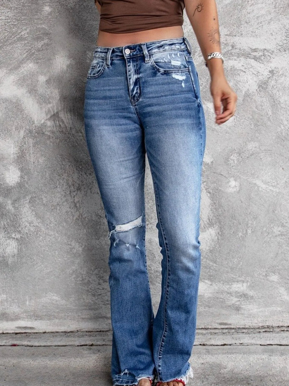 Distressed flare jeans front view