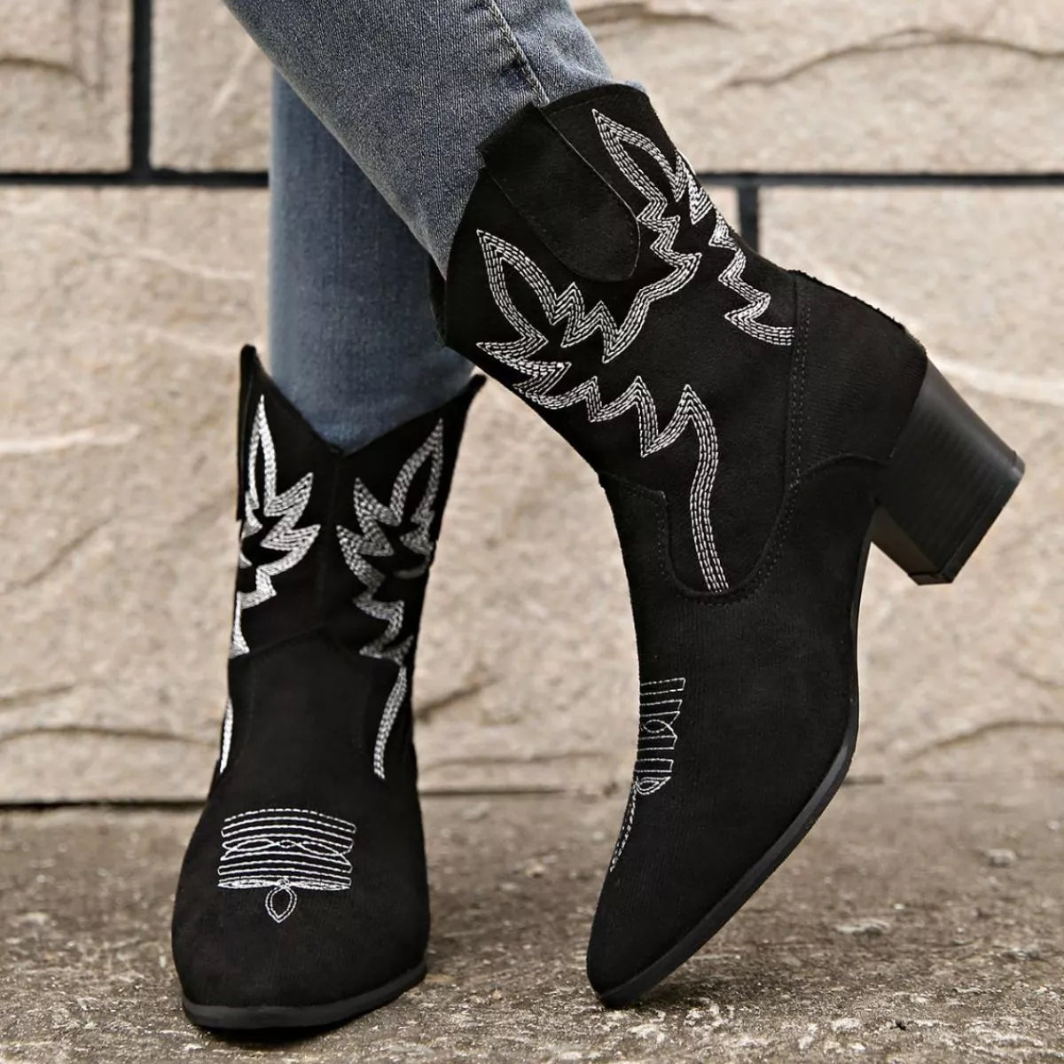 Point toe block heels boots pair standing together