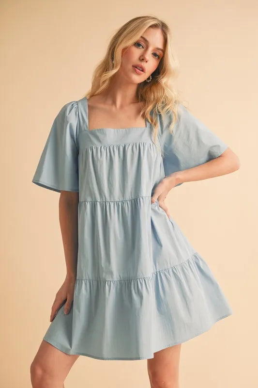 Tiered dress side view on model
