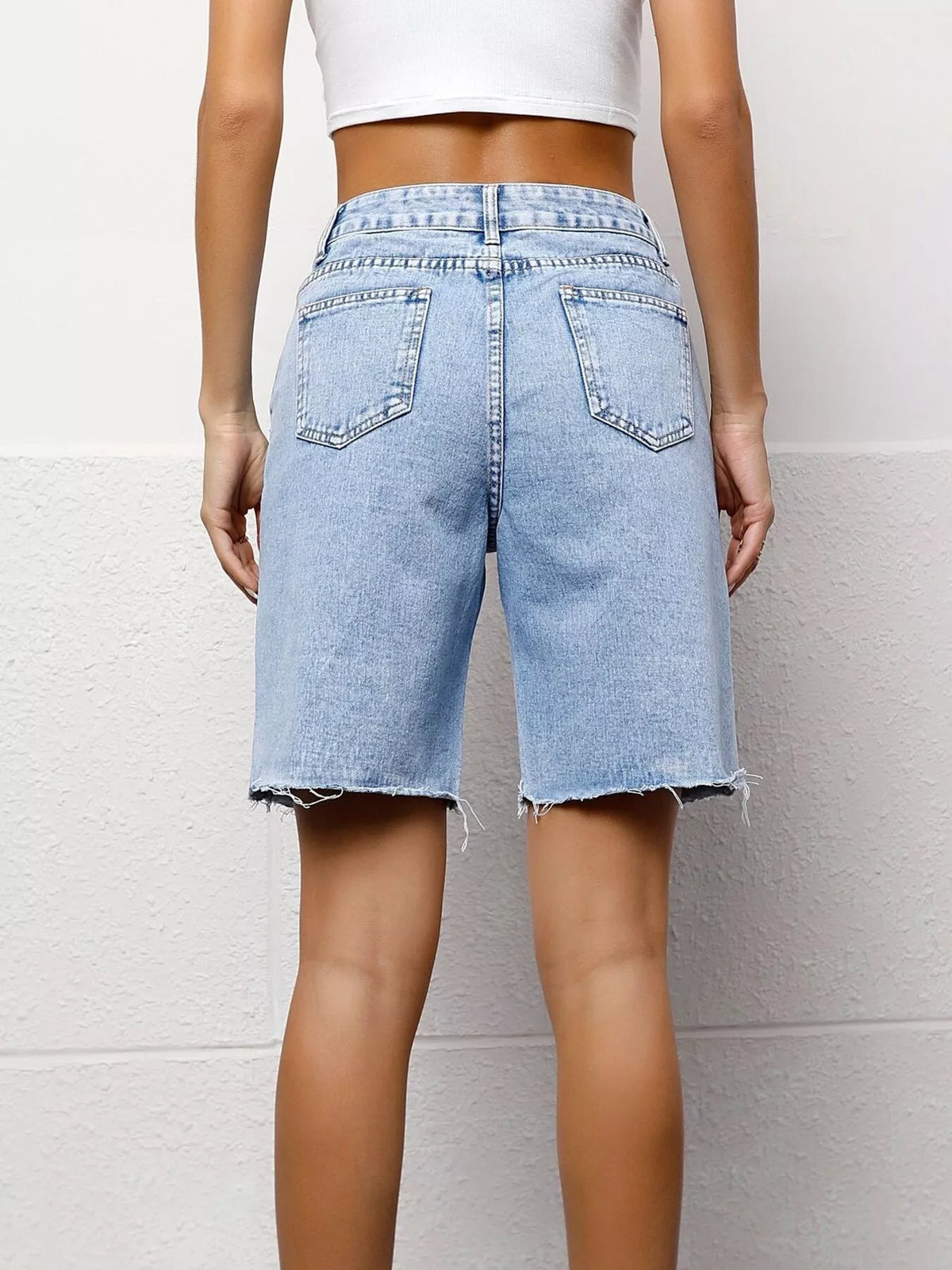 Blue high waist denim shorts detail view