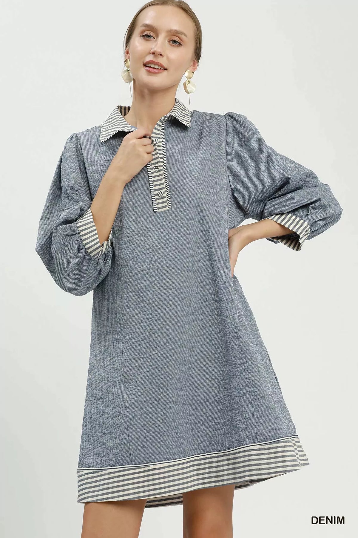 Striped puff sleeve mini dress shown from the side