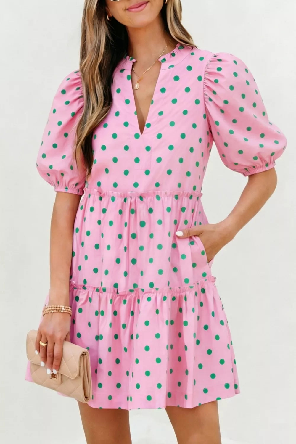 Blush pink polka dot tiered mini dress front view