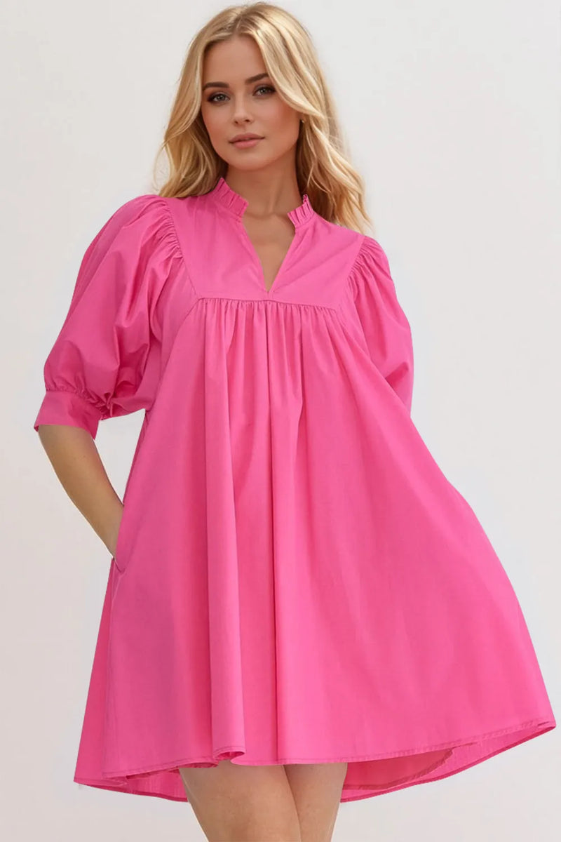 Puff sleeve babydoll mini dress front view on model