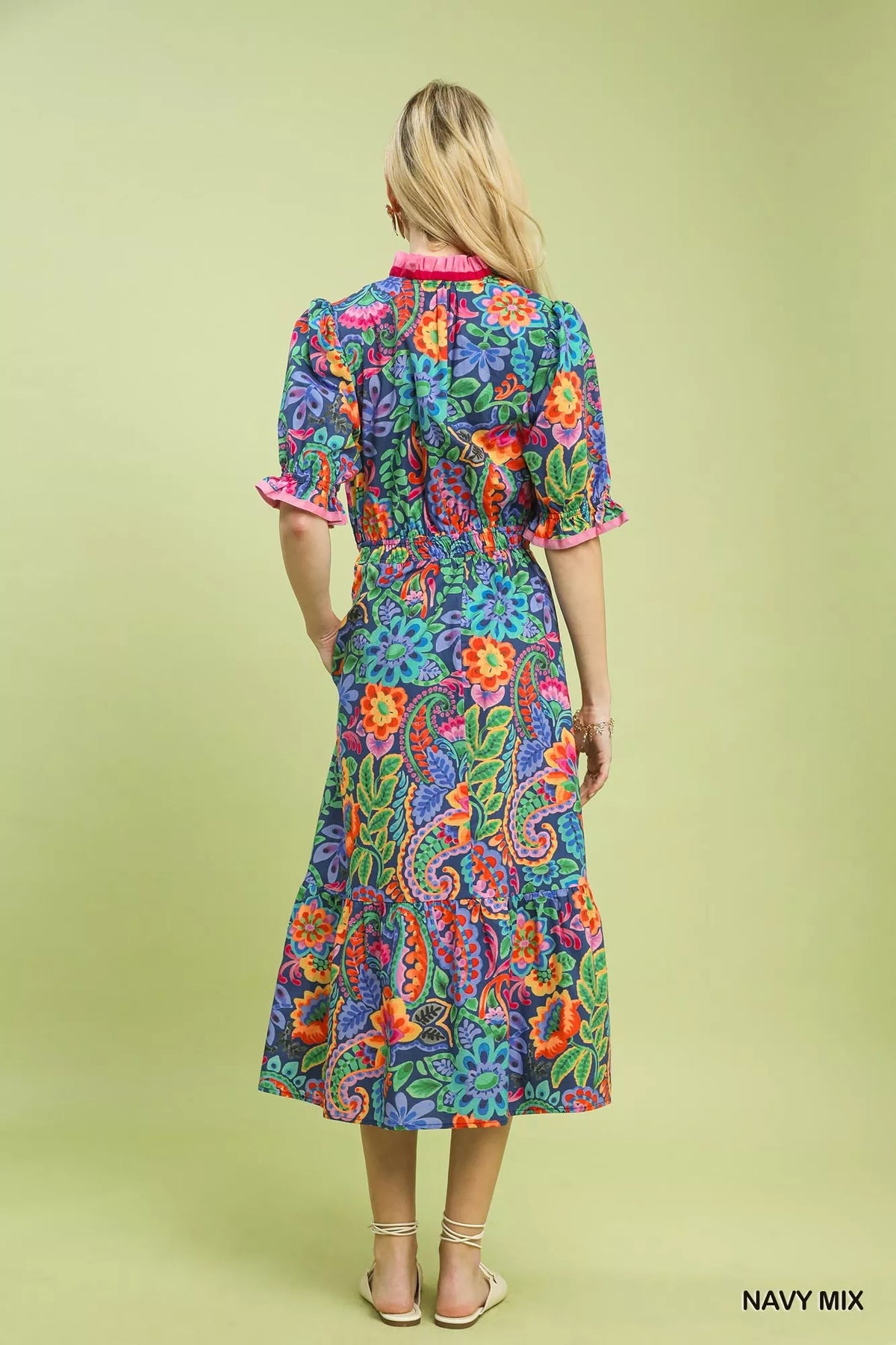 Close view of the ruffle trimmed neckline and mixed floral print