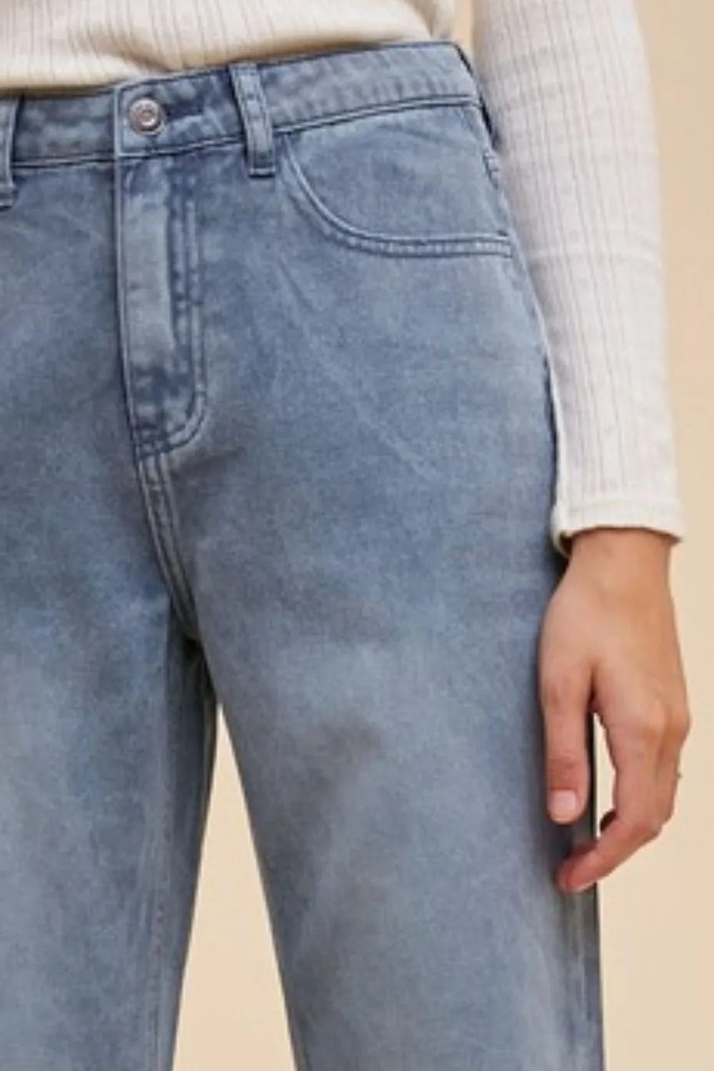 Dusty blue raw hem jeans back view