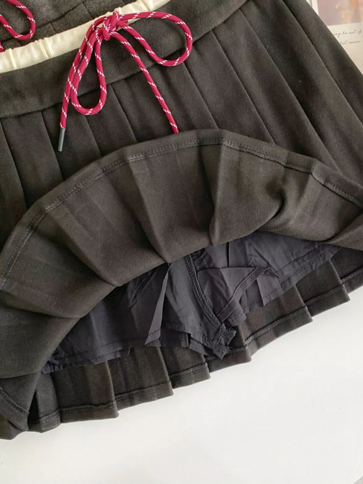 Pleated mini skirt side view