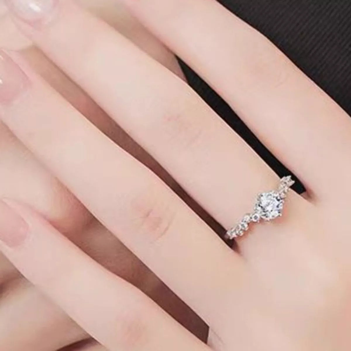 Moissanite ring shown with its matching box
