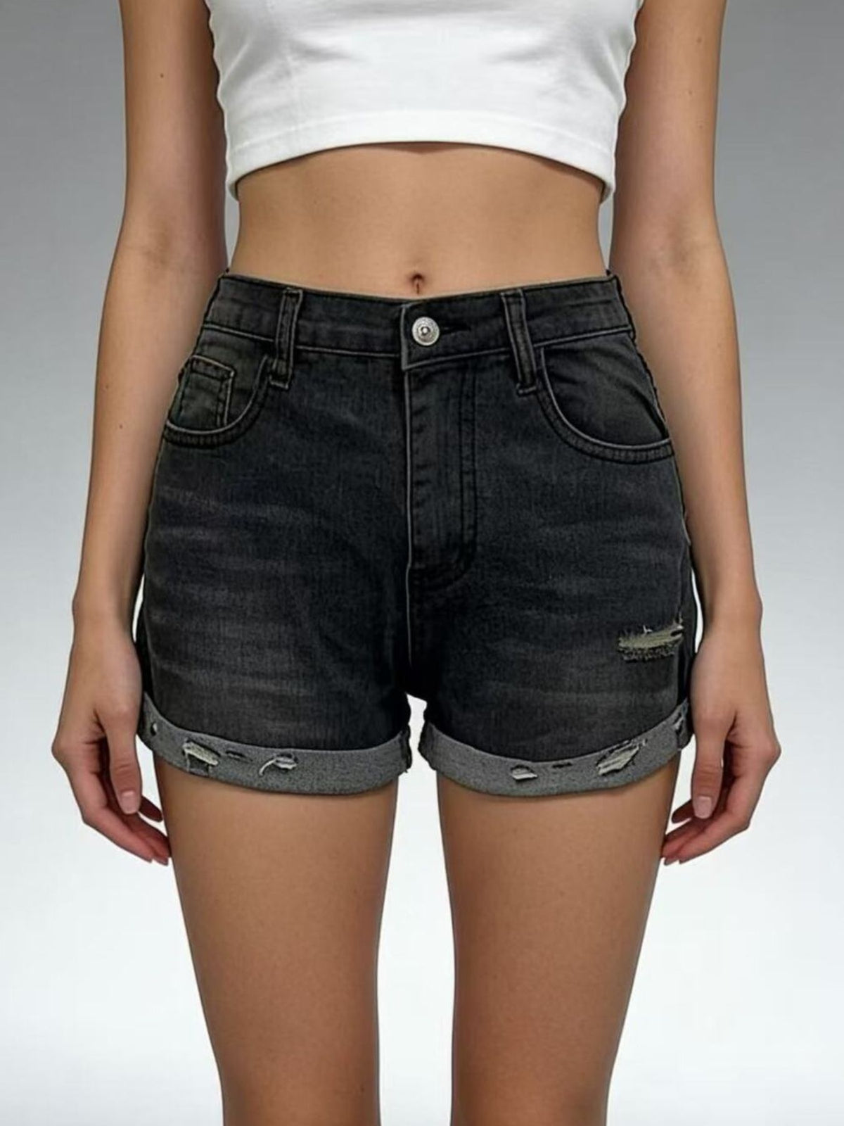 Rolled up hem detail on denim shorts