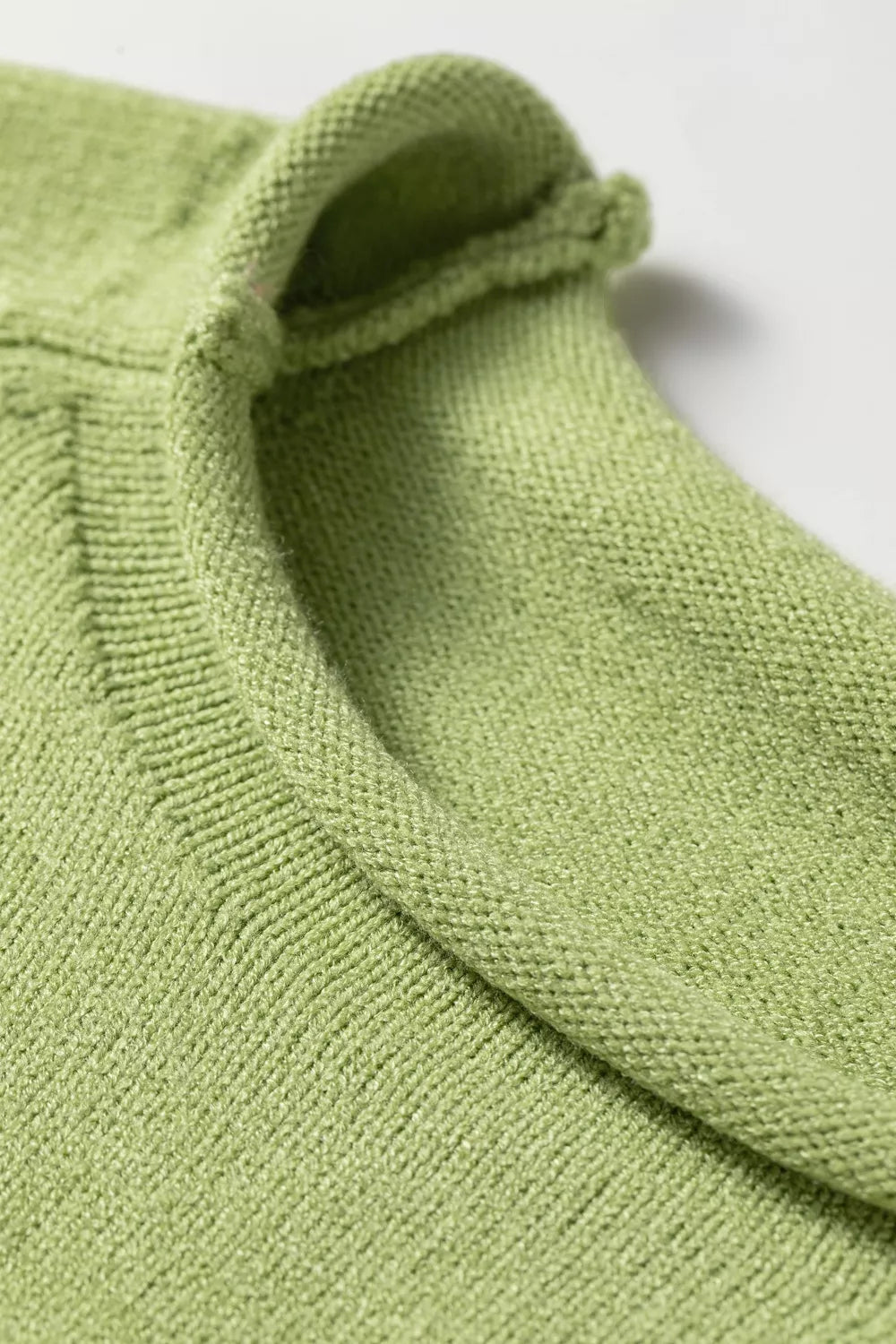 Sage graphic sweater close up detail
