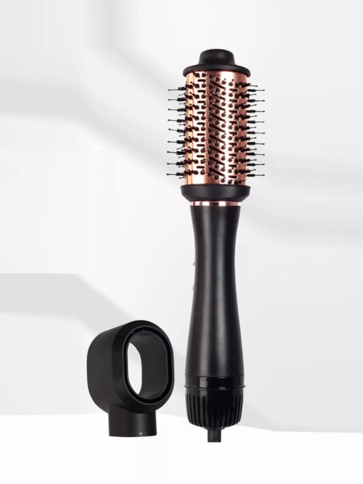 Hot air brush held in hand while styling