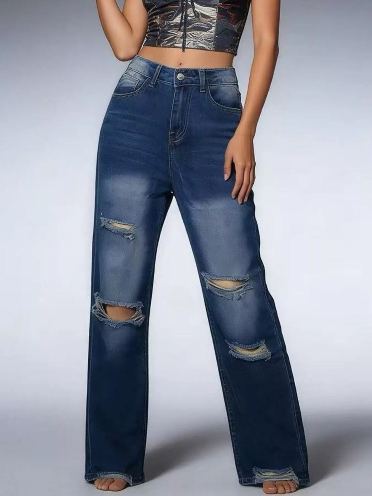 Buttoned waist on distressed jeans