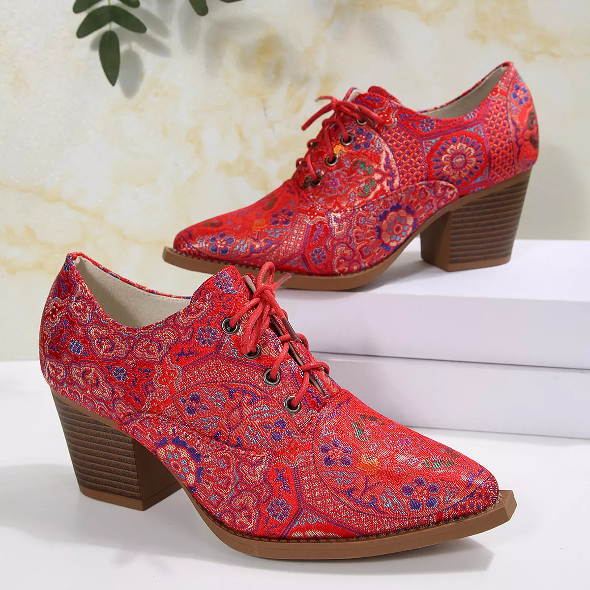 Point toe ankle boots pair standing together