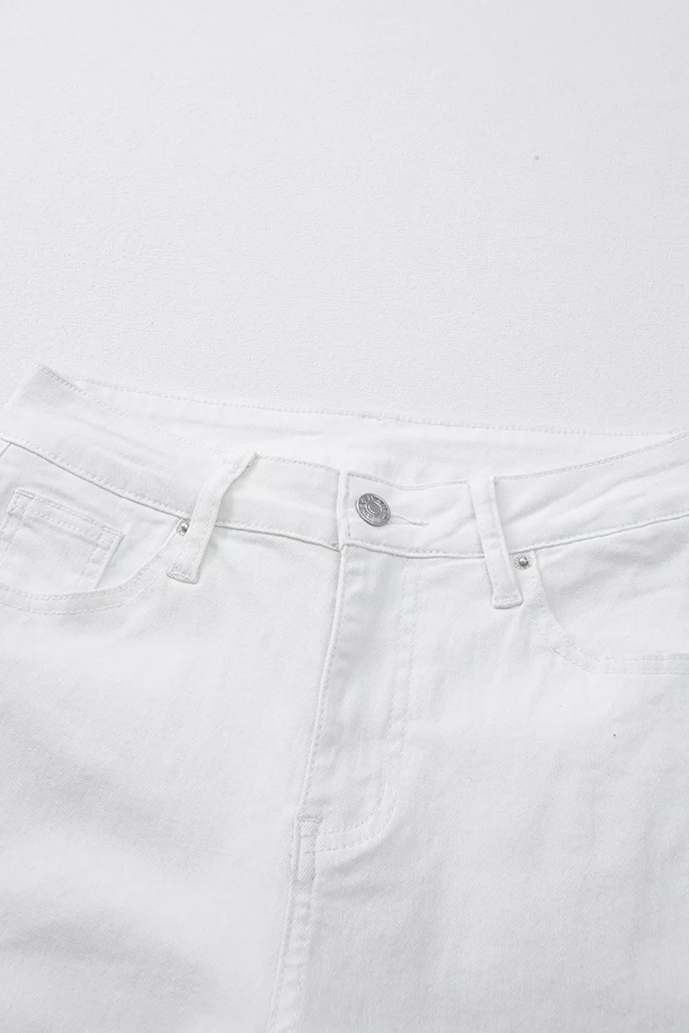 White jeans styled with a light top