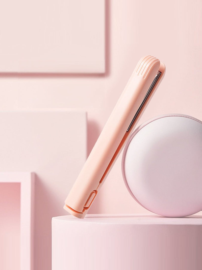Pink portable cordless hair straightener