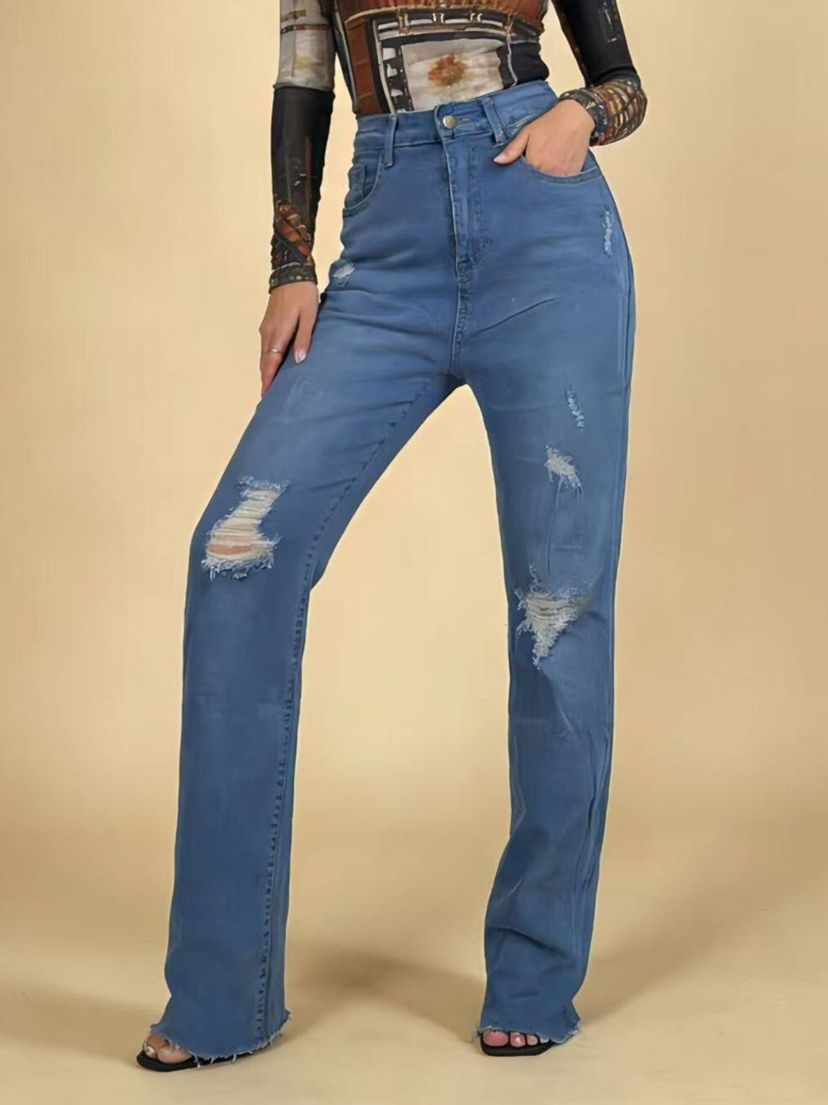 Blue distressed jeans styled full length
