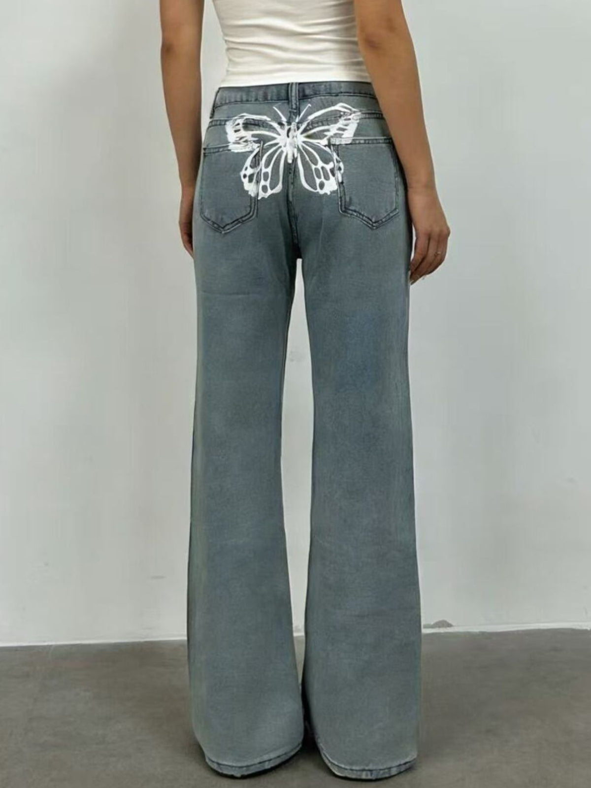 Hem detail of wide leg butterfly jeans
