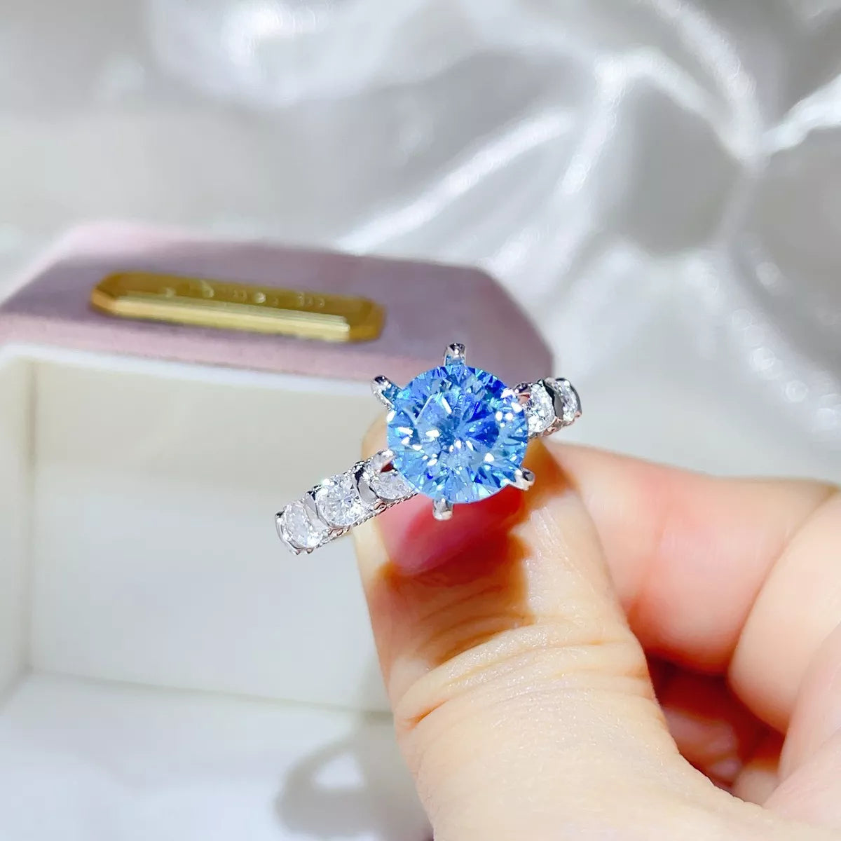 Starglow 3 carat moissanite silver ring with a blue stone