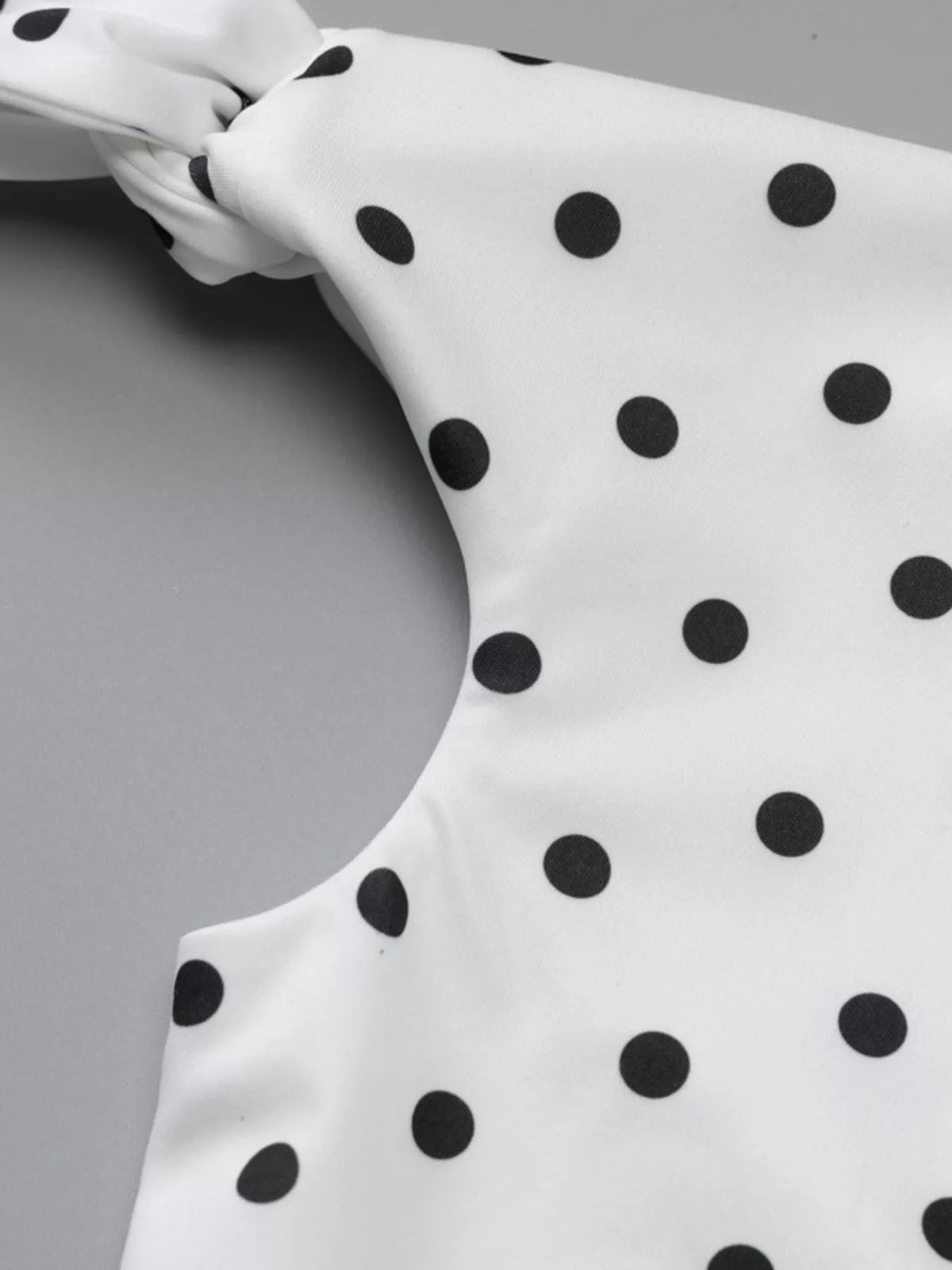 Sable polka dot bow accent mini dress in red, front view