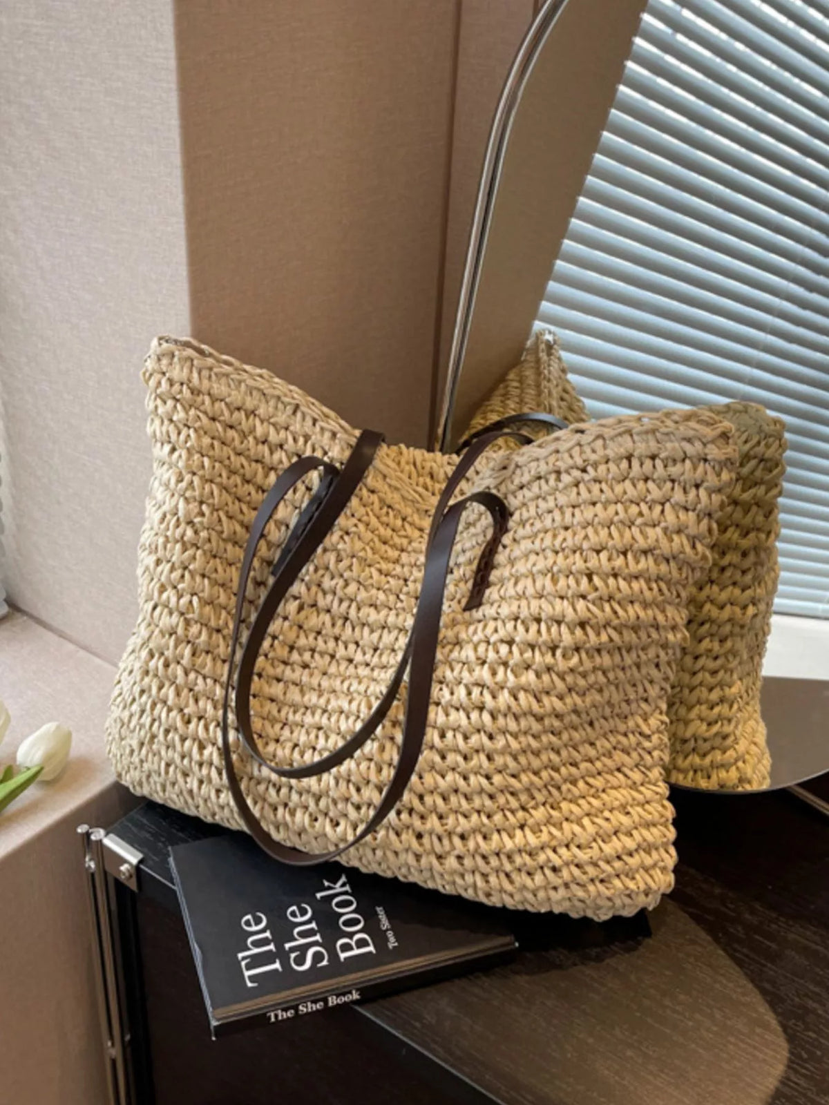 Large woven straw shoulder bag front view