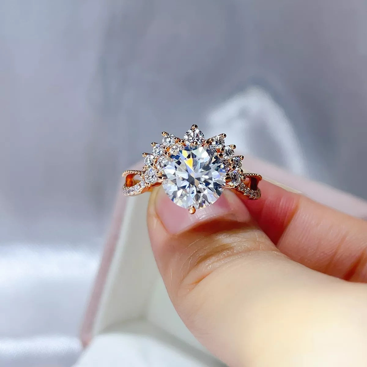 Gold moissanite ring photographed with its matching box