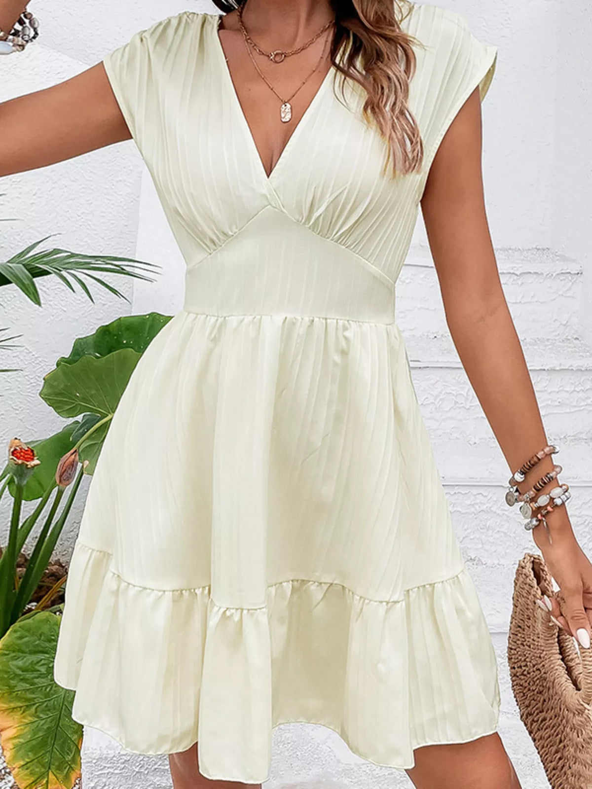 Tiered mini dress side view showing layered skirt tiers