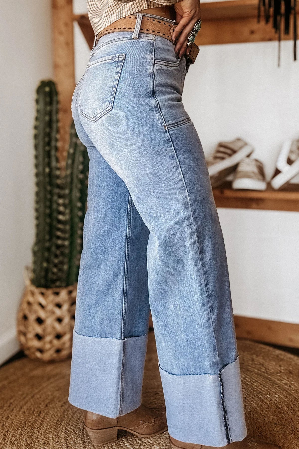 Turn up cuff detail on blue loose jeans