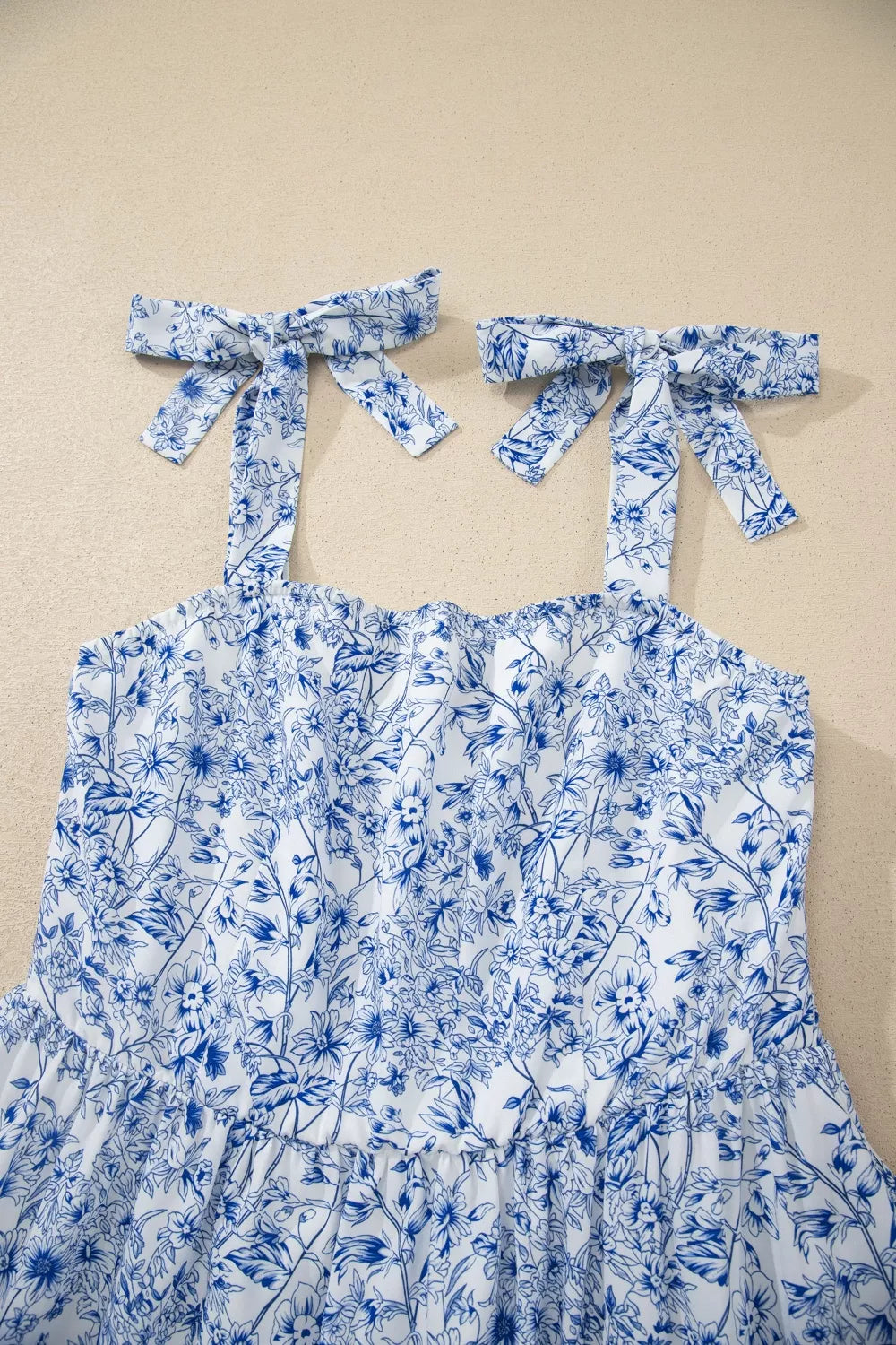 Light blue floral knot strap high waist flared maxi dress front view