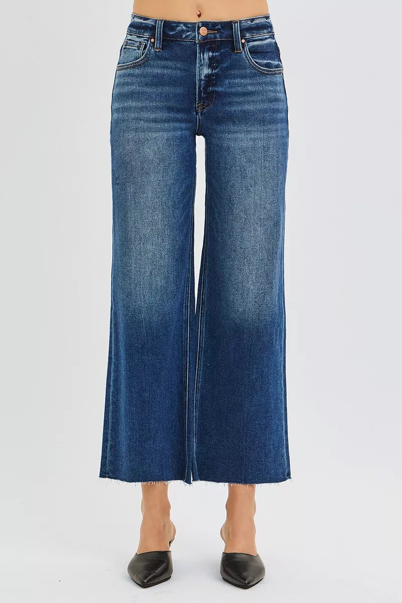 RISEN mid rise cropped wide leg raw hem jeans front view in dark blue