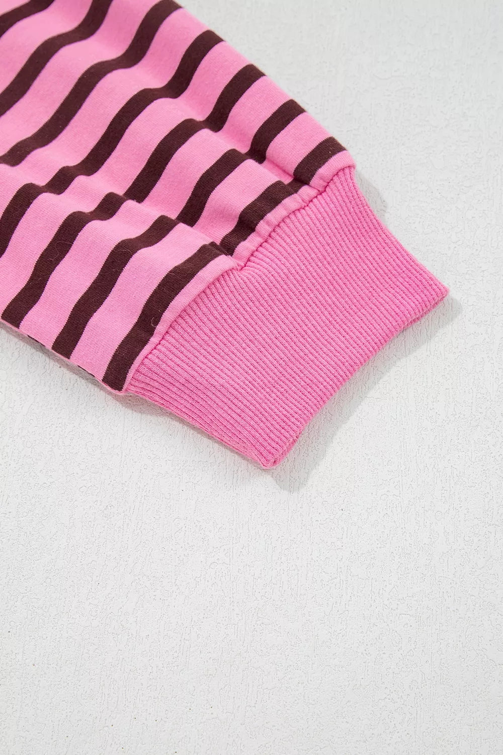 Seated view of the striped long sleeve top
