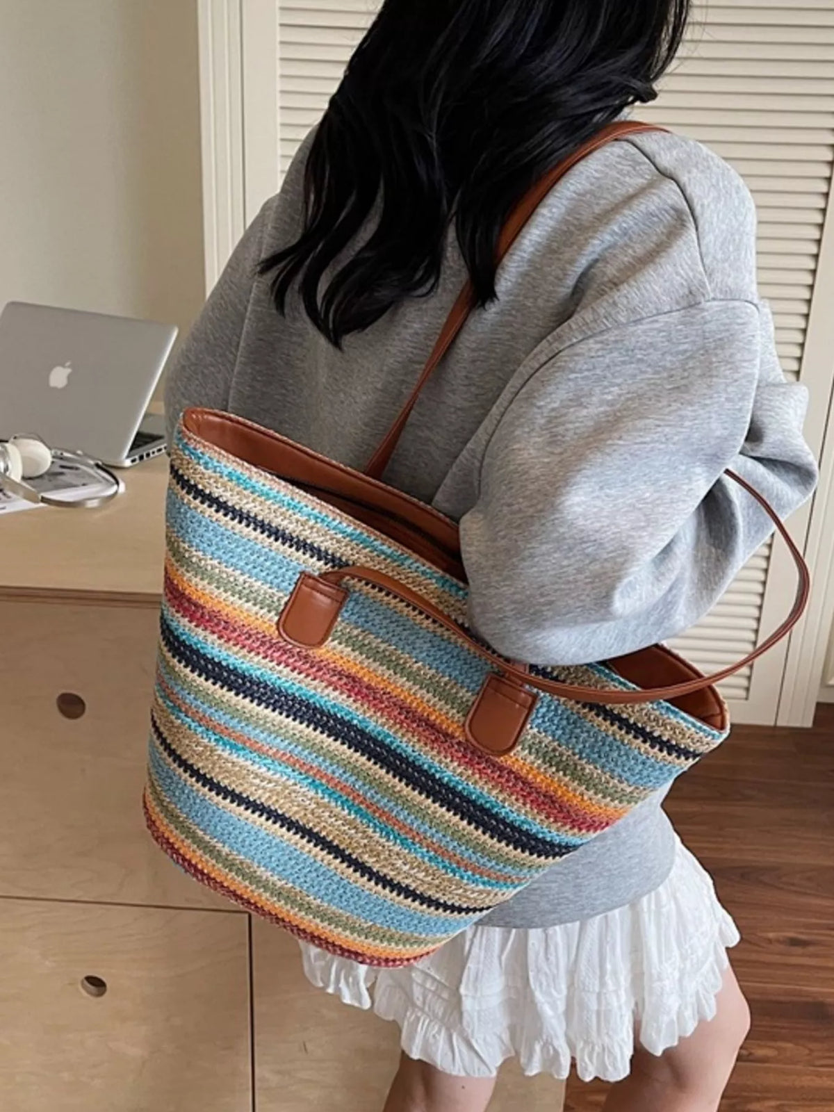 Straw shoulder bag styled for summer