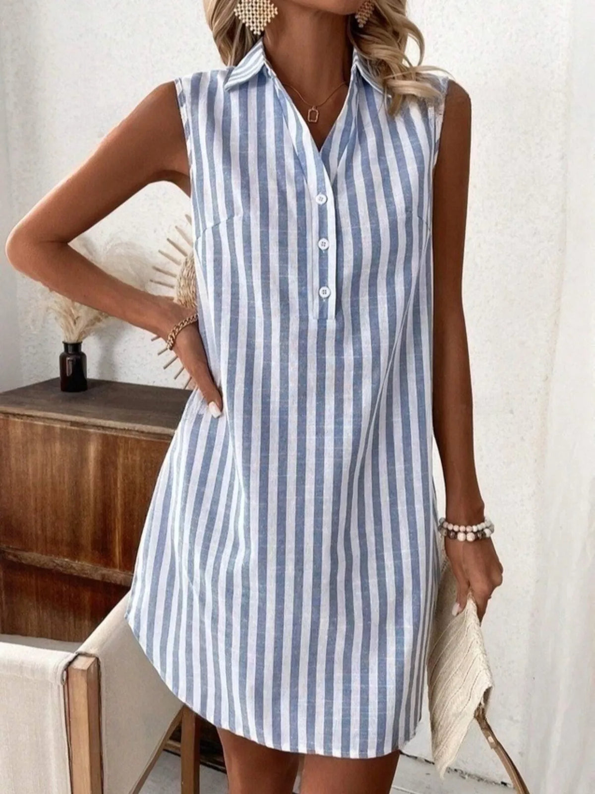Blue striped sleeveless button front shirt dress front view