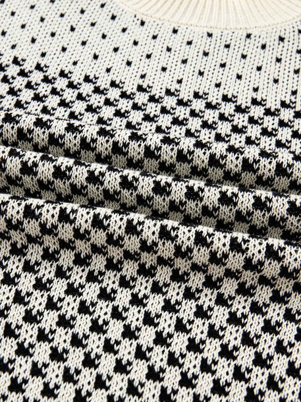 Black contrast color lantern sleeve sweater fabric detail view